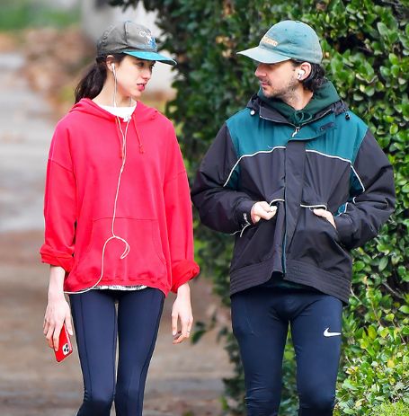 Margaret Qualley and Shia LeBeouf in the park.